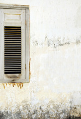 Old wooden window on old wall background texture