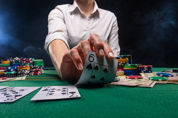 Poker game in a casino, online gaming business. Success and big winnings.