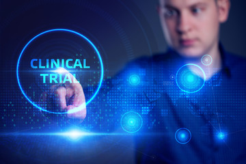 Business, Technology, Internet and network concept. Business man working on the tablet of the future, select on the virtual display: Clinical trial