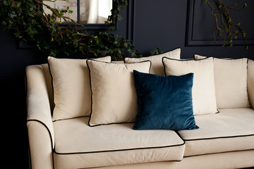 Closeup of soft fabric pillow decoration on beautiful sofa in living room home design concept