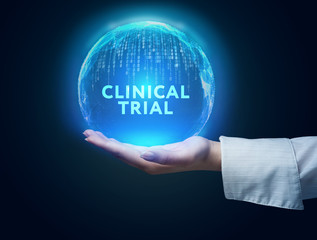 Business, Technology, Internet and network concept. Business man working on the tablet of the future, select on the virtual display: Clinical trial