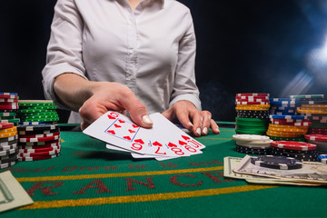 The croupier at the gaming table in the casino.