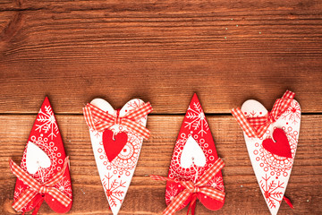 Valentine day post card: decorative wooden handmade crafted hearts. Top view