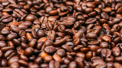 Many brown coffee beans, can be used as a background