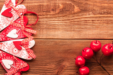 Valentine day post card: decorative wooden handmade crafted hearts. Top view