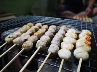 Grilled Meatballs Or Roasted Pork Balls At A Local Food Market, Asian Walking Street Food. Thai Style Street Food.
