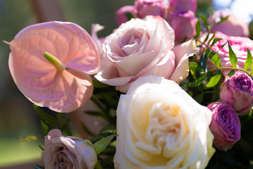 Bouquets of fresh flowers decoration of the festive table. Celebrating an open air party. Decor Details