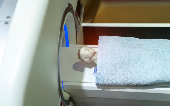 model patient undergoing CT scan in hospital