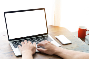 mockup image blank screen computer,cell phone with white background for advertising text,hand man using laptop texting mobile contact business search information on desk in cafe.marketing,design