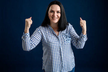 Young woman dressed casually smiling joyfully and looking happy