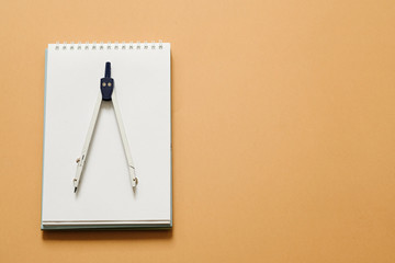 Drawing Compass Isolated on beige background, copy space. Geometry, mathematics, engineering