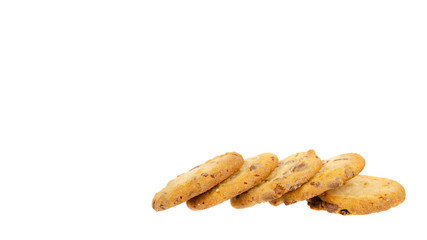 Round cookie with chocolate drops. Isolated on white.