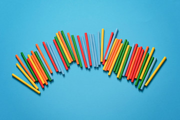 Colorful plastic math stick for learning mathematic in primary school or counting sticks on blue background