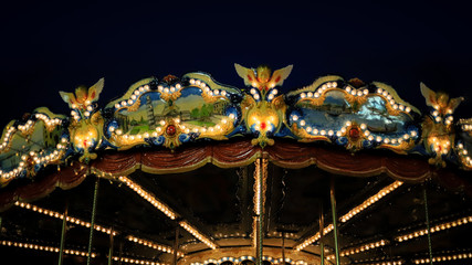 element vintage beautiful children's carousel with animals on a black background