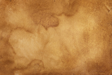 The surface of a brown crumpled stained old ancient vintage sheet of paper. Abstract trendy modern...