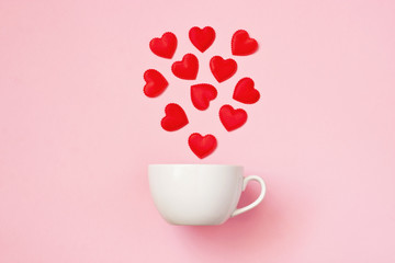 Valentines day concept with white coffee cup and heart shapes