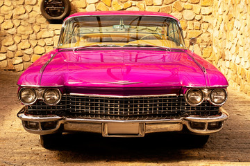  Vintage classic retro car. Beautiful pink auto, front view