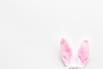 Easter bunny's ears on white background top-down copy space