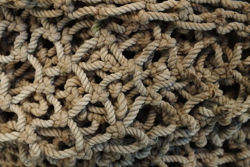background macro image of a braided fishing net with large meshes