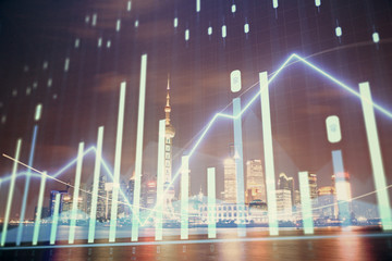 Financial graph on night city scape with tall buildings background multi exposure. Analysis concept.