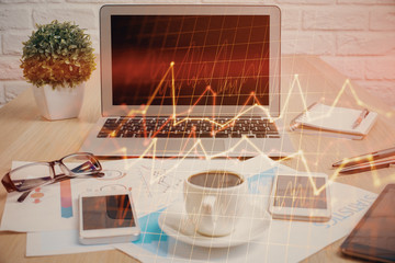 Double exposure of forex chart and work space with computer. Concept of international online...