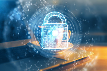 Double exposure of desktop with computer and lock icon hologram. Concept of data safety.