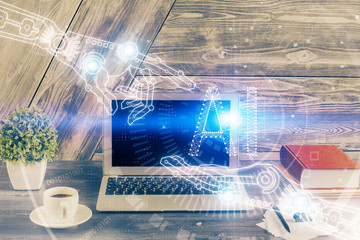 Double exposure of desktop computer and technology theme hologram. Concept of software development.