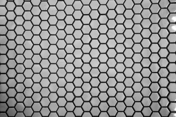 Close up texture and surface of Hexagonal white mosaic floor and wall tiles