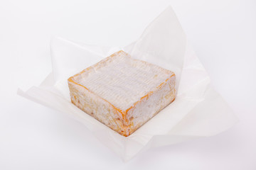 french cow's milk cheese called Pont-l'Évêque isolated on white background