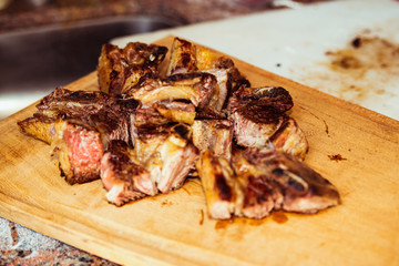 Roasted sliced barbecue meat ribs, focus on sliced meat.