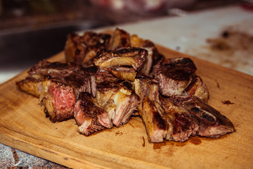 Roasted sliced barbecue meat ribs, focus on sliced meat.