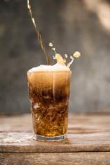 sparkling water splashing on grey background.