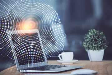 Double exposure of table with computer and brain hologram. Data innovation concept.