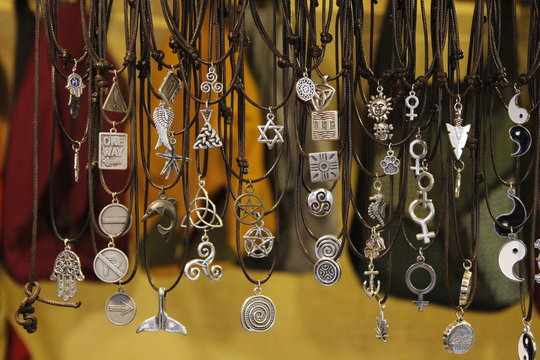 Set of necklaces of different symbols in a medieval market.