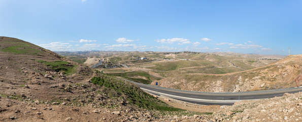 Panoramic view of the hills of Samaria with villages and Jerusalem visible in the distance in Israel - obrazy, fototapety, plakaty