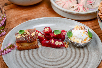 Traditional georgian sweets and desserts. Churchhela, ice cream and baklava with caramel, nuts and grape juice