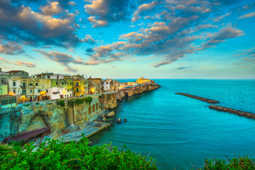 Fototapeta premium Vieste town on the rocks at sunset, Gargano, Apulia, Italy.