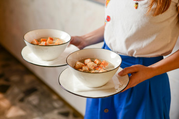 Close up of classic chicken noodle soup with crackers.