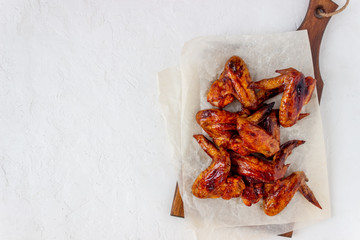 Grilled chicken wings on a white background. Snack to beer. Barbecue. 