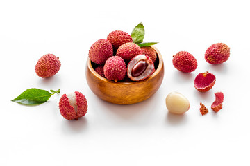 Ripe lychee. Exotic asian fruits in bowl on white desk