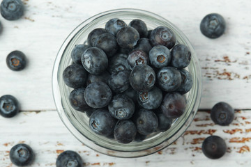 A glass bowl with blueberry