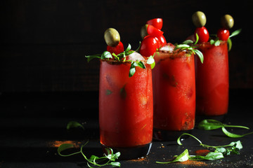 Three glasses with Bloody Mary cocktail  © nastyakamysheva