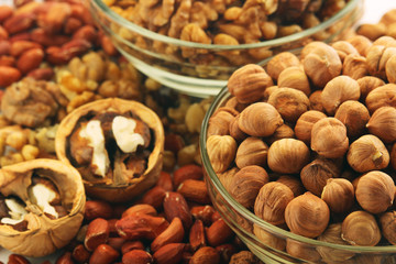 Different nuts in glass cups