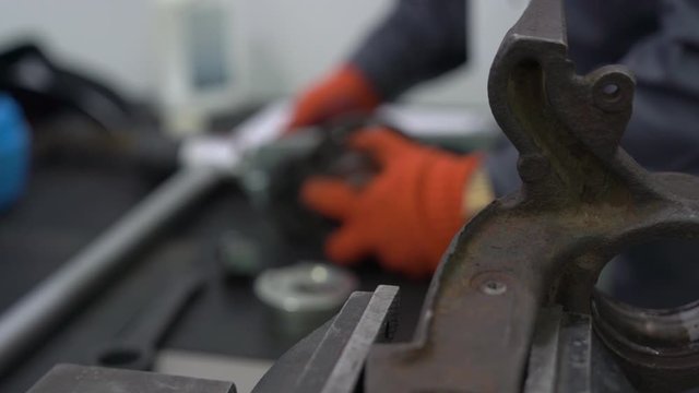 Engine car parts repair disassembled crankcase at service station internal of machine vehicle black motor camera movement