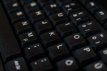 Photo macro digital keyboard computer for business on the dark and little light