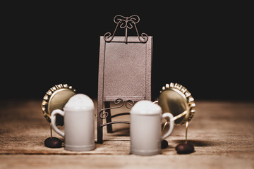 Crown cork miniature figures with beer jugs or mugs and a empty standee billboard