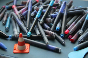 Pen inks hand writing signature and can opener 