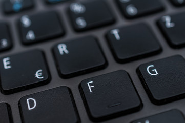 Photo macro digital keyboard computer for business on the dark and little light