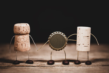 Three different bottle tops, cork for champagne, wine and crown are the best friends, concept...