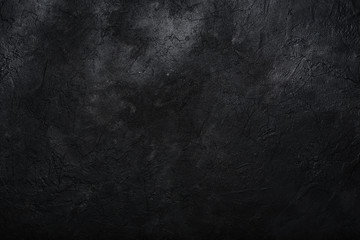 Dark textured concrete wall background. Copy space
